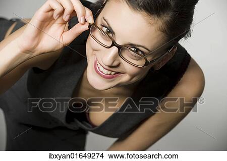 Picture - Young woman with glasses. Fotosearch