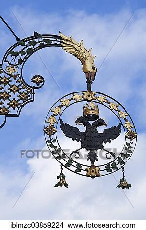 Picture - "18th century hanging sign of the former """"Schwarzer Adler"""" guesthouse, Wangen, Allgau, Bavaria, Germany, Europe". Fotosearch