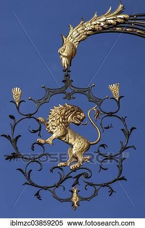 Stock Photography - "18th century hanging sign of the former """"Goldener Lowe"""" guesthouse, Wangen, Allgau, Bavaria, Germany, Europe". Fotosearch