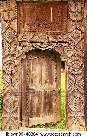 Picture - "19th century traditional Iza Valley farm house carved wooden folk art gates, Village Museum, near Sighet, Maramures, northern Transylvania, Romania, Europe". Fotosearch