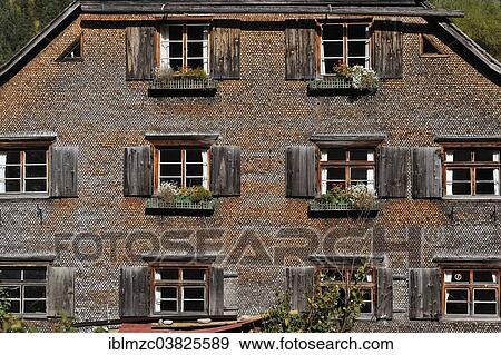 "200 year old farmhouse with a shingled facade, now a holiday house, Hinterstein, Upper Allgau, Bavaria, Germany, Europe" View Large Photo Image Stock Photo - "200 year old farmhouse with a shingled facade, now a holiday house, Hinterstein, Upper Allgau, Bavaria, Germany, Europe". Fotosearch