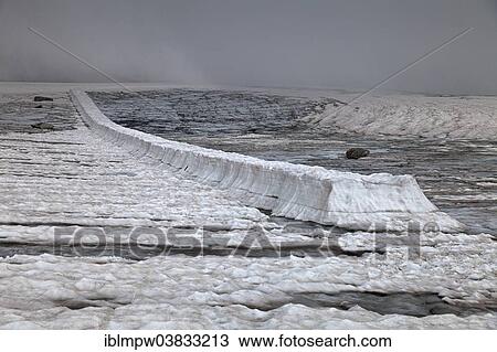 Stock Image - "250 x 3 meters long and 1. 70 meters high glacier table, formed by a cover on Cavardiras Glacier, Graubunden, Switzerland, Europe". Fotosearch