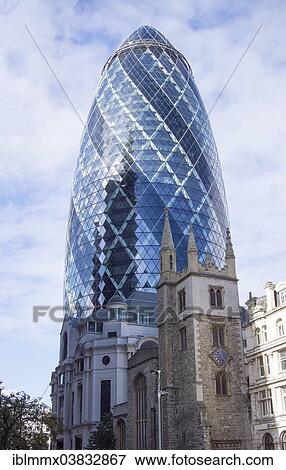 Stock Photo - "30 St Mary Axe or The Gherkin, in front the anglican church Saint Andrew Undershaft, England, United Kingdom, Europe". Fotosearch