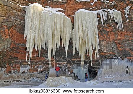 "5 m long icicles hanging from red sandstone cliff, Apostle Islands National Lakeshore, Lake Superior, Bayfield, Wisconsin, USA" View Large Photo Image Stock Image - "5 m long icicles hanging from red sandstone cliff, Apostle Islands National Lakeshore, Lake Superior, Bayfield, Wisconsin, USA". Fotosearch