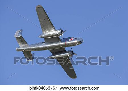 "A B-25 Mitchell flying in a flight display during the Red Bull Air Race, Red Bull Ring, Spielberg, Styria, Austria, Europe" View Large Photo Image Stock Photo - "A B-25 Mitchell flying in a flight display during the Red Bull Air Race, Red Bull Ring, Spielberg, Styria, Austria, Europe". Fotosearch
