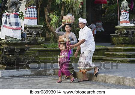 "A Balinese family returning from a temple festival, Pura Dalem Puri Temple, Peliatan, Ubud, Bali, Indonesia, Asia" View Large Photo Image Picture - "A Balinese family returning from a temple festival, Pura Dalem Puri Temple, Peliatan, Ubud, Bali, Indonesia, Asia". Fotosearch