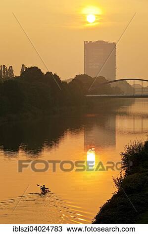 "A canoeist on the Rhine-Herne Canal at sunset with Gasometer, Oberhausen, Ruhr district, North Rhine-Westphalia, Germany, Europe" View Large Photo Image Stock Image - "A canoeist on the Rhine-Herne Canal at sunset with Gasometer, Oberhausen, Ruhr district, North Rhine-Westphalia, Germany, Europe". Fotosearch