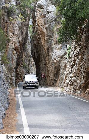 "A car driving through a rock crevice in the Tramuntana mountain range, Sa Calobra, Serra de Tramuntana, Majorca, Balearic Islands, Spain, Europe" View Large Photo Image Stock Photo - "A car driving through a rock crevice in the Tramuntana mountain range, Sa Calobra, Serra de Tramuntana, Majorca, Balearic Islands, Spain, Europe". Fotosearch