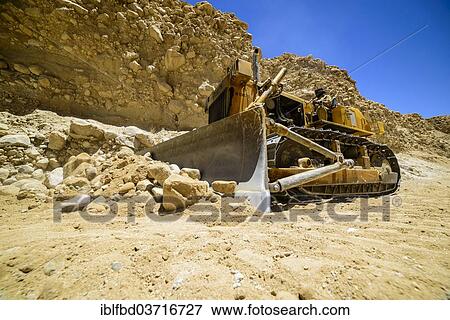 "A caterpillar is cleaning the road after a landslide at a road construction site, Ladakh, Jammu and Kashmir, India, Asia" View Large Photo Image Stock Photo - "A caterpillar is cleaning the road after a landslide at a road construction site, Ladakh, Jammu and Kashmir, India, Asia". Fotosearch