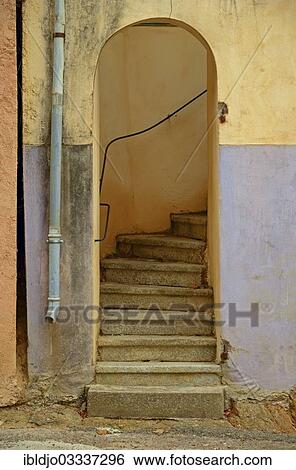 "A colorful decaying facade with a gate and a stone stairway in the small village of Montemaggiore. Montemaggiore is in the department Haute-Corse, France on the mediterranean island of Corsica, Montemaggiore, Corsica, France, Europe" View Large Photo Image Stock Photograph - "A colorful decaying facade with a gate and a stone stairway in the small village of Montemaggiore. Montemaggiore is in the department Haute-Corse, France on the mediterranean island of Corsica, Montemaggiore, Corsica, France, Europe". Fotosearch