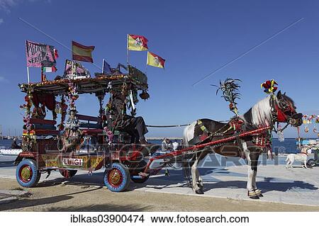 "A colourfully decorated Sicilian horse cart for tourists, Caretto Siciliano, Foro Italico leisure park, Villa a Mare, Palermo, Sicily, Italy, Europe" View Large Photo Image Picture - "A colourfully decorated Sicilian horse cart for tourists, Caretto Siciliano, Foro Italico leisure park, Villa a Mare, Palermo, Sicily, Italy, Europe". Fotosearch