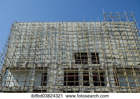 "A construction site of a new concrete building with bamboo scaffolding attached, Ahmedabad, Gujarat, India, Asia" View Large Photo Image Stock Image - "A construction site of a new concrete building with bamboo scaffolding attached, Ahmedabad, Gujarat, India, Asia". Fotosearch