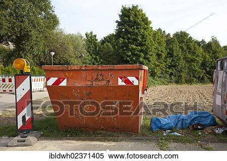 Stock Photography - "A container and garbage on the side of a road, Kamen, Ruhr area, North Rhine-Westphalia, Germany, Europe, PublicGround, Europe". Fotosearch