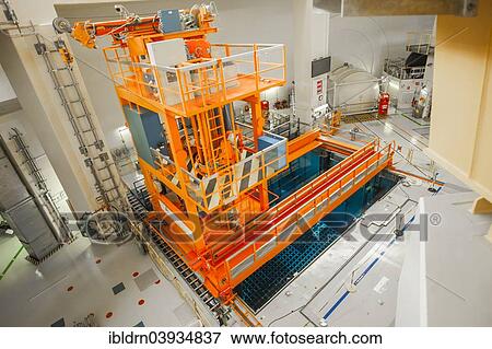 "A crane above a cooling pond for spent fuel rods below the reactor dome at the Emsland nuclear power plant of the RWE Power AG, Lingen, Lower Saxony, Germany, Europe" View Large Photo Image Stock Photo - "A crane above a cooling pond for spent fuel rods below the reactor dome at the Emsland nuclear power plant of the RWE Power AG, Lingen, Lower Saxony, Germany, Europe". Fotosearch