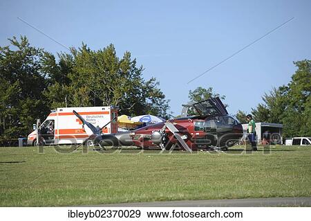 "A crashed EC 120 helicopter, an ambulance standing at the back, Metzingen, Baden-Wuerttemberg, Germany, Europe" View Large Photo Image Stock Photo - "A crashed EC 120 helicopter, an ambulance standing at the back, Metzingen, Baden-Wuerttemberg, Germany, Europe". Fotosearch