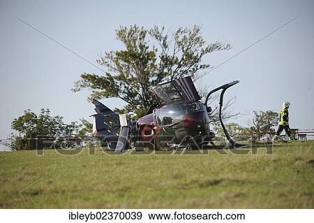 "A crashed EC 120 helicopter, an ambulance standing at the back, Metzingen, Baden-Wuerttemberg, Germany, Europe" View Large Photo Image Stock Photo - "A crashed EC 120 helicopter, an ambulance standing at the back, Metzingen, Baden-Wuerttemberg, Germany, Europe". Fotosearch