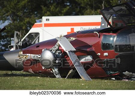 "A crashed EC 120 helicopter, an ambulance standing at the back, Metzingen, Baden-Wuerttemberg, Germany, Europe" View Large Photo Image Stock Photograph - "A crashed EC 120 helicopter, an ambulance standing at the back, Metzingen, Baden-Wuerttemberg, Germany, Europe". Fotosearch