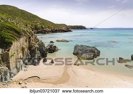 "A creek running through the sand of the Spiaggia di Planusartu bay into the sea, Masua, Iglesiente, Sardinia, Italy, Europe" View Large Photo Image Stock Photo - "A creek running through the sand of the Spiaggia di Planusartu bay into the sea, Masua, Iglesiente, Sardinia, Italy, Europe". Fotosearch
