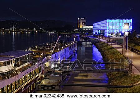 "A cruise ship and the Lentos Art Museum on the Danube river, as seen from Nibelungenbruecke bridge, Linz, Upper Austria, Austria, Europe, PublicGround, Europe" View Large Photo Image Stock Photography - "A cruise ship and the Lentos Art Museum on the Danube river, as seen from Nibelungenbruecke bridge, Linz, Upper Austria, Austria, Europe, PublicGround, Europe". Fotosearch