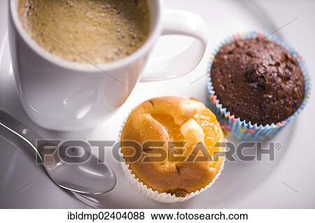 A cup of coffee and two muffins View Large Photo Image Stock Photo - A cup of coffee and two muffins. Fotosearch