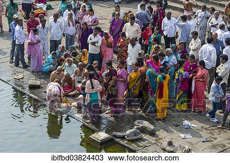 "A family and a pandit or priest are performing Dashkriya or Asthi Visarjan, a ritual which is performed 10 days after the death of a family member, Nasik, Maharashtra, India, Asia" View Large Photo Image Stock Image - "A family and a pandit or priest are performing Dashkriya or Asthi Visarjan, a ritual which is performed 10 days after the death of a family member, Nasik, Maharashtra, India, Asia". Fotosearch