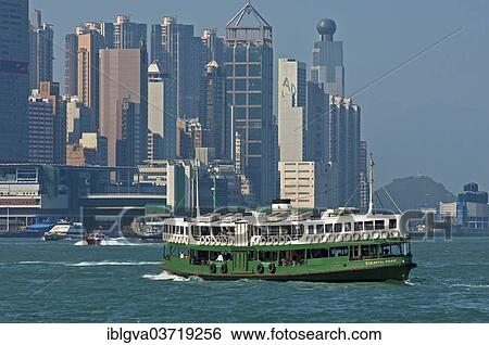 Stock Photograph - "A ferry of the """"Star Ferry"""" shipping company crosses the basin of the Victoria Harbour, Central District, Hong Kong, Hong Kong Island, Hong kong, China, People's Republic of China, Asia". Fotosearch