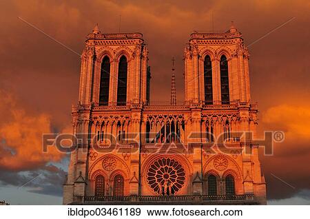 Stock Photo - "A front view of Notre Dame during sunset, Paris, Ile-de-France, France, Europe". Fotosearch