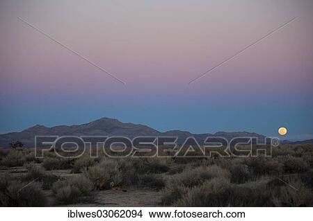 "A full moon rises over Fremont Peak, Mojave Desert, Kramer Junction, California, United States, North America" View Large Photo Image Picture - "A full moon rises over Fremont Peak, Mojave Desert, Kramer Junction, California, United States, North America". Fotosearch