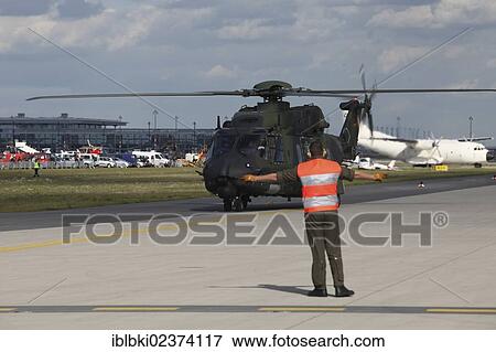 Stock Photo - "A German military helicopter landing, ILA Berlin Air Show, Berlin, Germany, Europe". Fotosearch