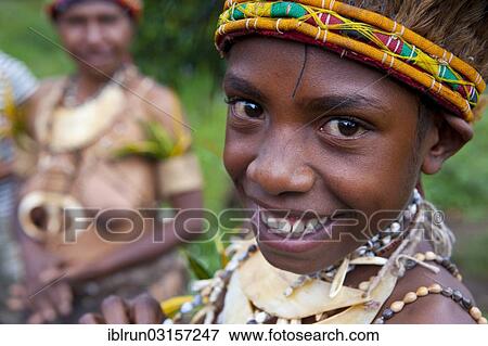 "A girl in a colourful costume is celebrating at the traditional sing Sing gathering in the Highlands, Paya, Papua New Guinea, Oceania" View Large Photo Image Stock Photo - "A girl in a colourful costume is celebrating at the traditional sing Sing gathering in the Highlands, Paya, Papua New Guinea, Oceania". Fotosearch