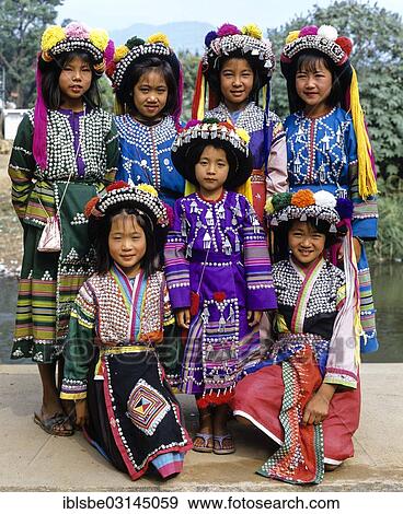 "A group of Lisu hill tribe girls wearing traditional costumes and headdresses, Mae Sai, Chiang Rai Province, Northern Thailand, Thailand, Asia" View Large Photo Image Stock Photo - "A group of Lisu hill tribe girls wearing traditional costumes and headdresses, Mae Sai, Chiang Rai Province, Northern Thailand, Thailand, Asia". Fotosearch