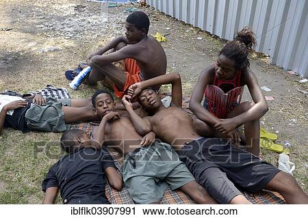 "A group of street children resting on blankets on a grassy area in the centre of Rio de Janeiro, Rio de Janeiro State, Brazil, South America" View Large Photo Image Stock Image - "A group of street children resting on blankets on a grassy area in the centre of Rio de Janeiro, Rio de Janeiro State, Brazil, South America". Fotosearch