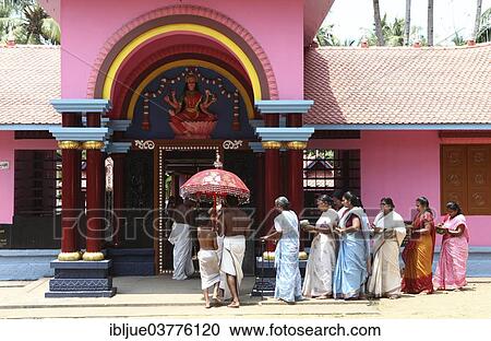 "A group of women with offerings and a priest circling a Hindu temple, Varkala, Kerala, India, Asia" View Large Photo Image Stock Image - "A group of women with offerings and a priest circling a Hindu temple, Varkala, Kerala, India, Asia". Fotosearch