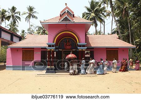 "A group of women with offerings and a priest circling a Hindu temple, Varkala, Kerala, India, Asia" View Large Photo Image Stock Photo - "A group of women with offerings and a priest circling a Hindu temple, Varkala, Kerala, India, Asia". Fotosearch