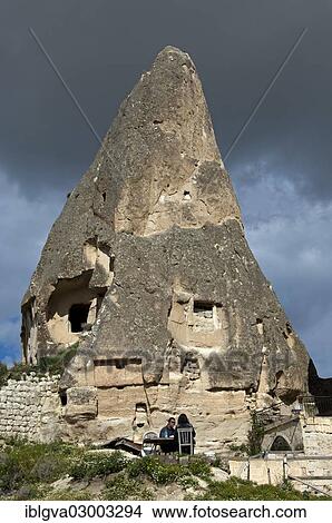 "A hollowed tuff cone or fairy chimney, two people sitting at a table in the foreground, Goreme National Park, Goreme, Cappadocia, Nevsehir Province, Central Anatolia Region, Turkey, Asia" View Large Photo Image Picture - "A hollowed tuff cone or fairy chimney, two people sitting at a table in the foreground, Goreme National Park, Goreme, Cappadocia, Nevsehir Province, Central Anatolia Region, Turkey, Asia". Fotosearch