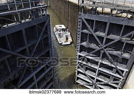 Stock Photo - "A houseboat on the Saar river, Mettlach lock, Saarland, Germany, Europe". Fotosearch