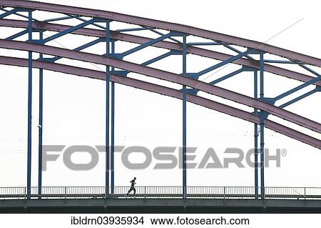 "A jogger on a canal bridge, Duisburg, Ruhr district, North Rhine-Westphalia, Germany, Europe" View Large Photo Image Picture - "A jogger on a canal bridge, Duisburg, Ruhr district, North Rhine-Westphalia, Germany, Europe". Fotosearch