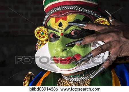 Stock Photography - "A Katakali artist with the complete make up of the character Krishna for the Santhana Gopalam play during a temple festival, Ayroor, Kerala, India, Asia". Fotosearch