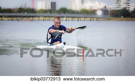 Stock Image - "A kayaker rowing a kayak, Copenhagen Beach Marathon for kayak and canoe 2013, Copenhagen, Capital region, Denmark, Europe". Fotosearch