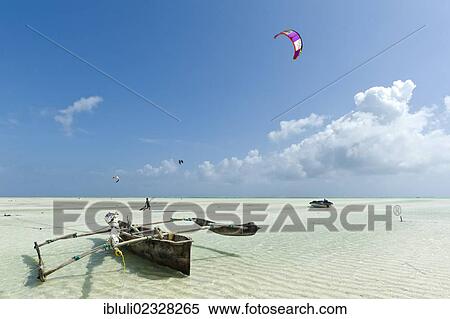 "A kite surfer and a fishing boat, Ngalawa, off Paje, east coast of Zanzibar, Tanzania, Africa" View Large Photo Image Stock Photography - "A kite surfer and a fishing boat, Ngalawa, off Paje, east coast of Zanzibar, Tanzania, Africa". Fotosearch