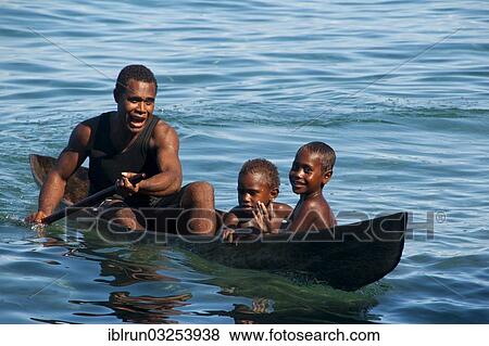 "A man and two children in a canoe, Savo Island, Central Province, Solomon Islands, Oceania" View Large Photo Image Stock Photo - "A man and two children in a canoe, Savo Island, Central Province, Solomon Islands, Oceania". Fotosearch