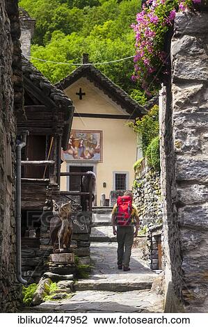 "A man hiking in the village of Foroglio, Bavona Valley, Val Bavona, Maggia Valley, Valle Maggia, Ticino, Switzerland, Europe" View Large Photo Image Stock Image - "A man hiking in the village of Foroglio, Bavona Valley, Val Bavona, Maggia Valley, Valle Maggia, Ticino, Switzerland, Europe". Fotosearch