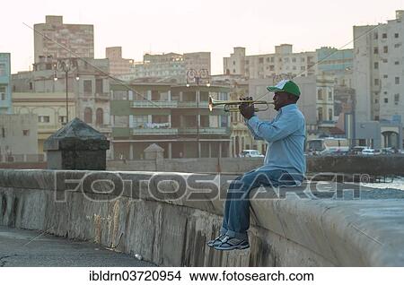 "A man playing the trumpet at the Malecon, Havana's seaside promenade, Havana, La Habanna, Cuba, North America" View Large Photo Image Picture - "A man playing the trumpet at the Malecon, Havana's seaside promenade, Havana, La Habanna, Cuba, North America". Fotosearch