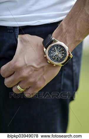 A man's hand with a Breitling watch and a wedding ring View Large Photo Image Stock Photo - A man's hand with a Breitling watch and a wedding ring. Fotosearch