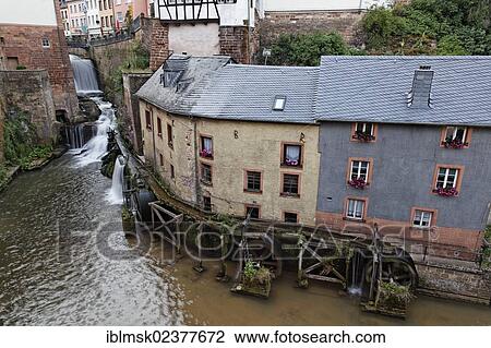 "A mill with 3 mill wheels on the Leukbach river, Saarburg, Rhineland-Palatinate, Germany, Europe" View Large Photo Image Stock Image - "A mill with 3 mill wheels on the Leukbach river, Saarburg, Rhineland-Palatinate, Germany, Europe". Fotosearch