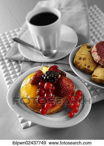 Stock Photo - "A modern fruit cake with redcurrants, wild strawberries, blackberry and creme patisserie in a light sponge case". Fotosearch