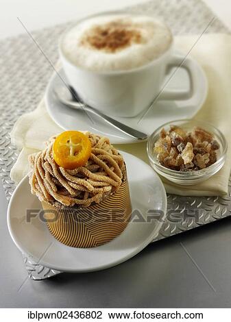 A modern Japanese cake with a pattered chocolate case and piped chestnut puree with cumquat sauce View Large Photo Image Stock Image - A modern Japanese cake with a pattered chocolate case and piped chestnut puree with cumquat sauce. Fotosearch