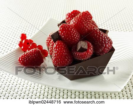 A modern square chocolate cake filled with chocolate truffle and topped with fresh raspberries View Large Photo Image Stock Photograph - A modern square chocolate cake filled with chocolate truffle and topped with fresh raspberries. Fotosearch