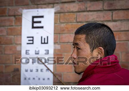 "A monk from Amitabha Monastery carrying out a vision test for poor villagers, Amitabha monastery, Nepal, Asia" View Large Photo Image Stock Image - "A monk from Amitabha Monastery carrying out a vision test for poor villagers, Amitabha monastery, Nepal, Asia". Fotosearch