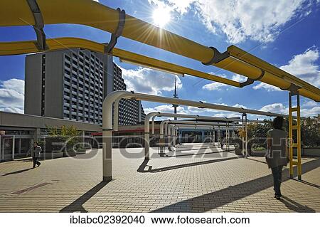 Stock Image - "A multistorey building and supply pipes in the former Olympic Village, Munich, Bavaria, Germany, Europe". Fotosearch